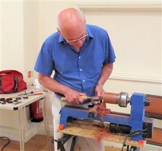 Geoff Horsfield turning pots with decorated lids